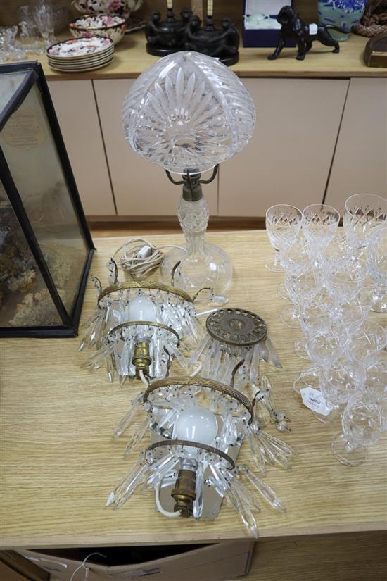 A cut glass table lamp, height 44cm and a pair of lustre wall lights